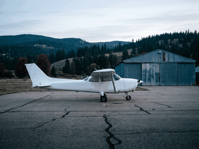 A flight student and instructor walking to a training plane, the route to a PGWP from a Canadian flight school