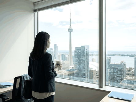 A graduate starting work in a Toronto office on a post-graduation work permit